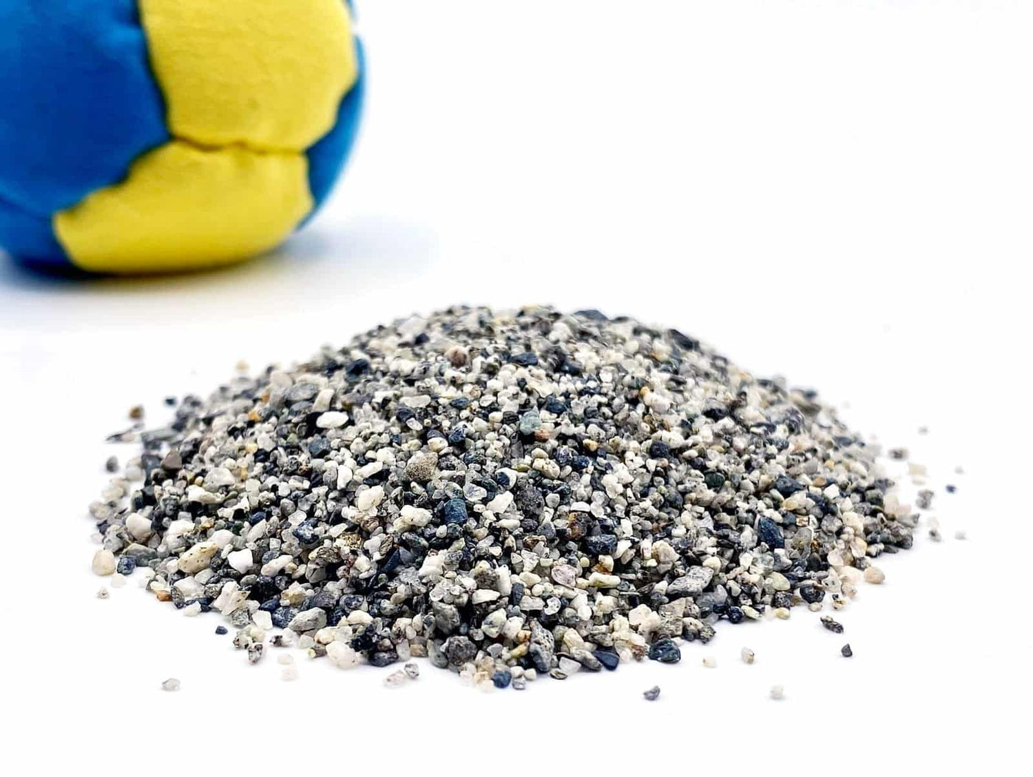 Sand footbag material piled in the center.